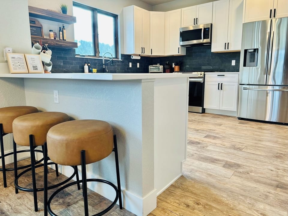 Barstools for additional seating in the spacious kitchen