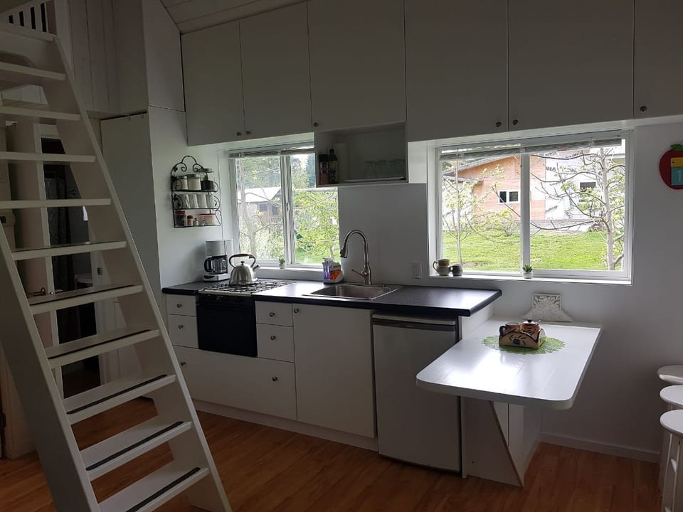 Kitchen. Stairs to the lofts.
