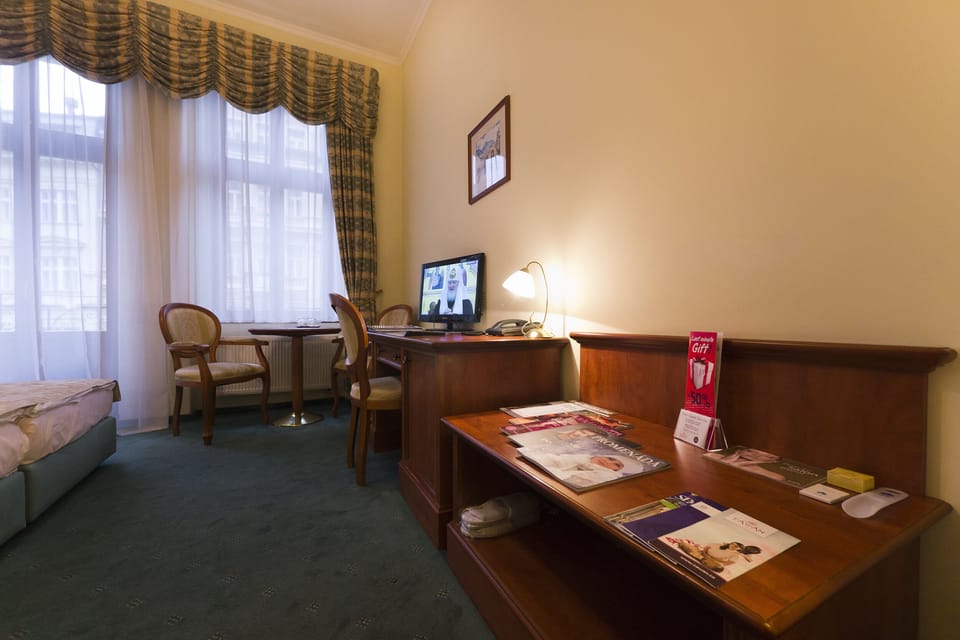 Double or Twin Room | Minibar, in-room safe, desk, blackout drapes