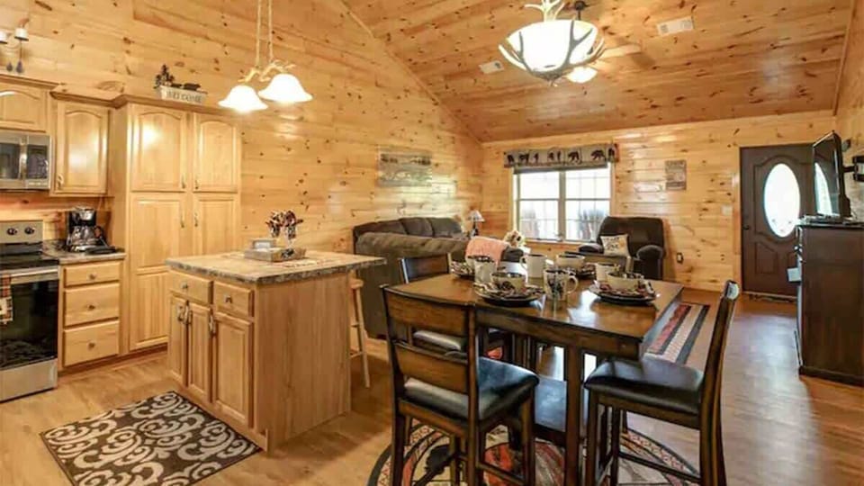 Kitchen & Dining Area: Delight in this charming space with rustic wooden accents and inviting decor!
