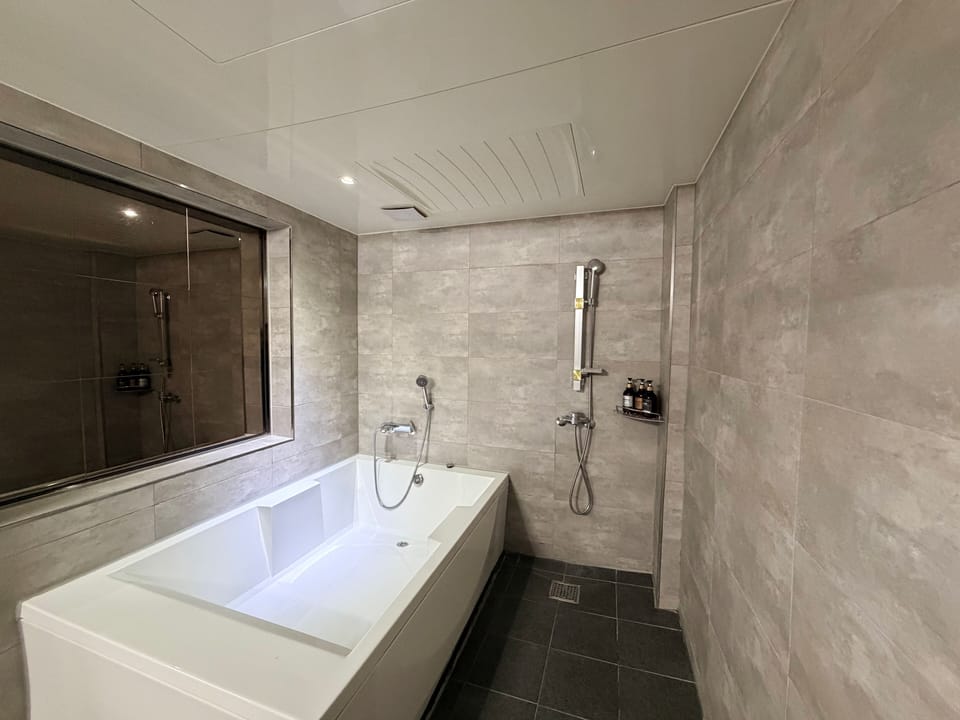 Premier Triple + Casual Breakfast | Bathroom | Shower, designer toiletries, hair dryer, bathrobes