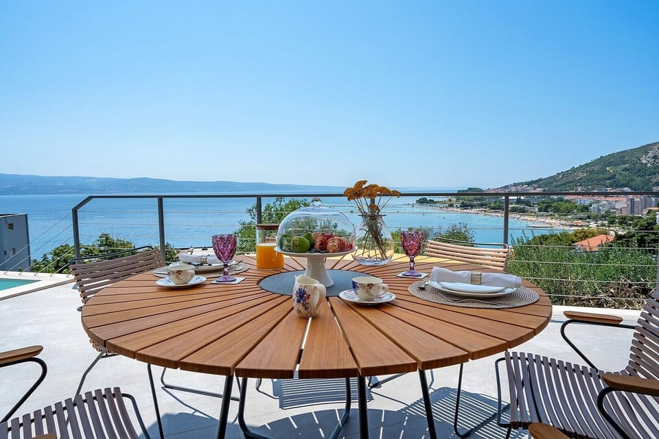 outdoor dining area with a sea view