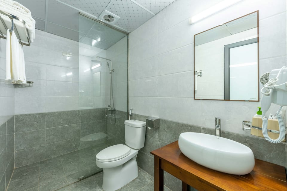 Shower, rainfall showerhead, designer toiletries, hair dryer