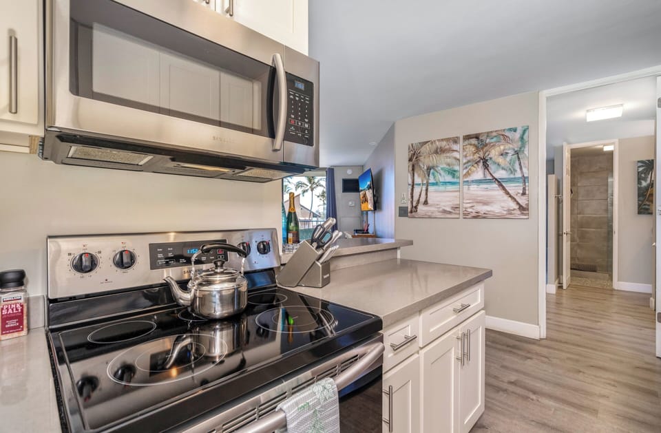 Luxury Condo | Private kitchen | Full-size fridge, microwave, oven, stovetop
