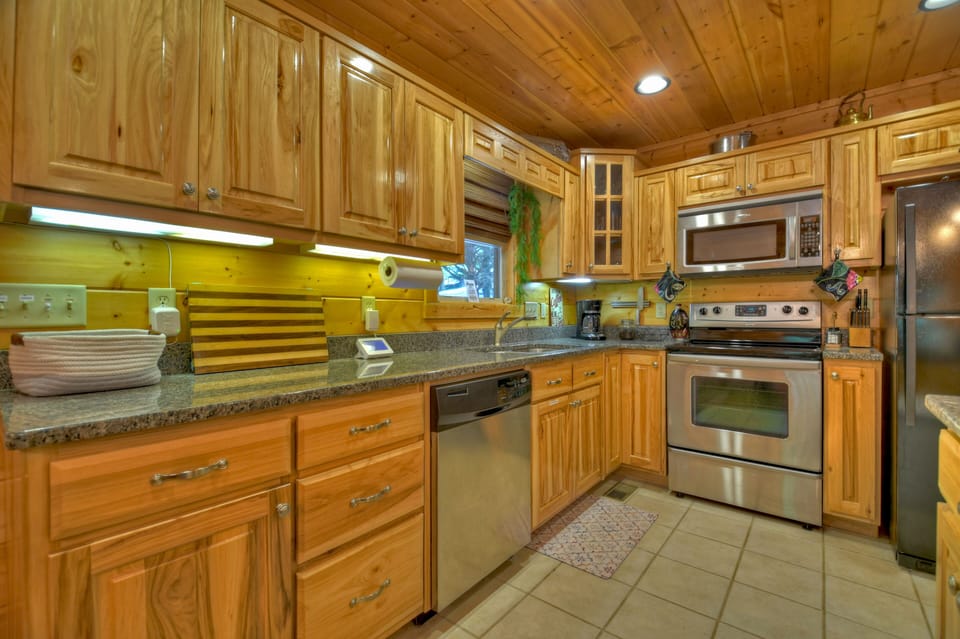Extended kitchen countertops with all major appliances and cooking requirements 