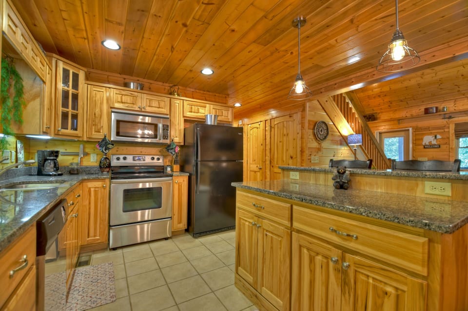 Fully stocked Kitchen w/ stainless steel appliances and kitchen island