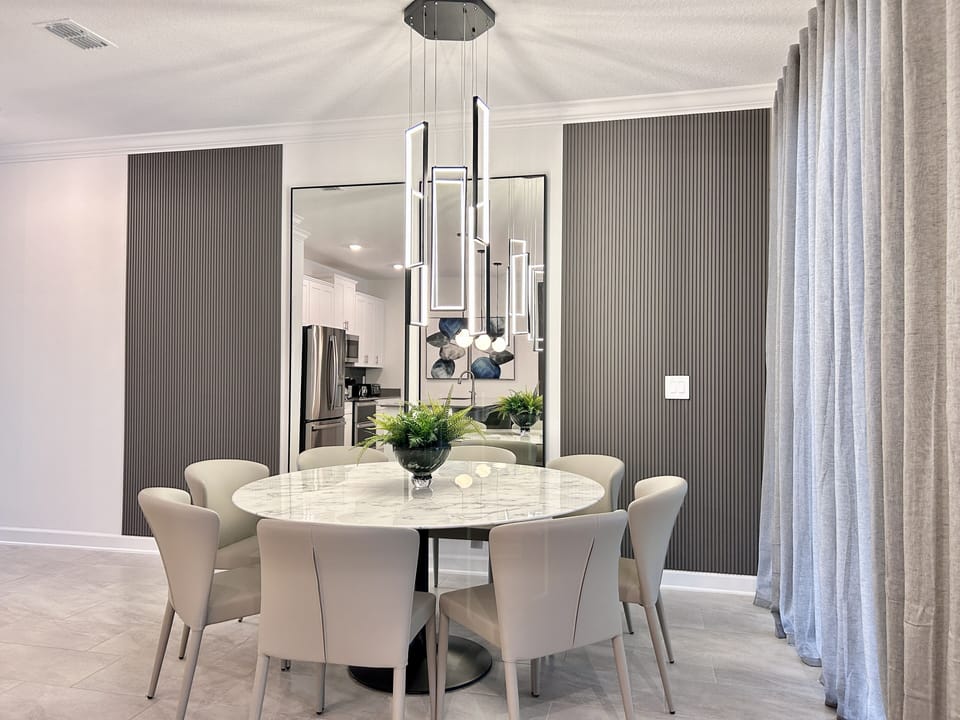 Dining room with ample space, perfect for gathering and enjoying meals together.