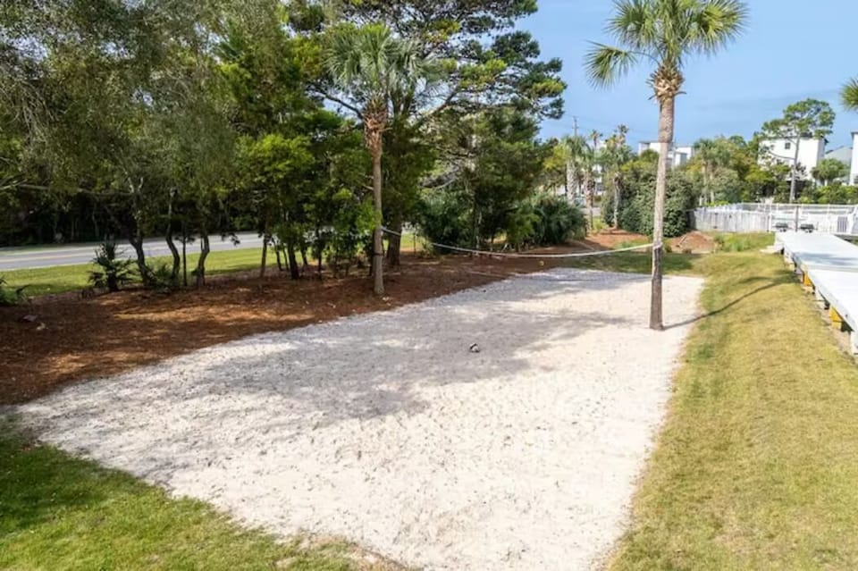 Sand volleyball courts are conveniently located in front of the townhome.