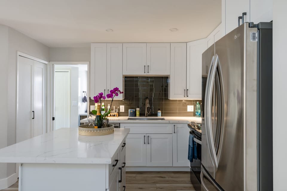 Luxury Condo | Private kitchen | Full-size fridge, microwave, oven, dishwasher