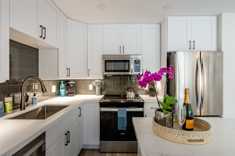 Luxury Condo | Private kitchen | Full-size fridge, microwave, oven, dishwasher