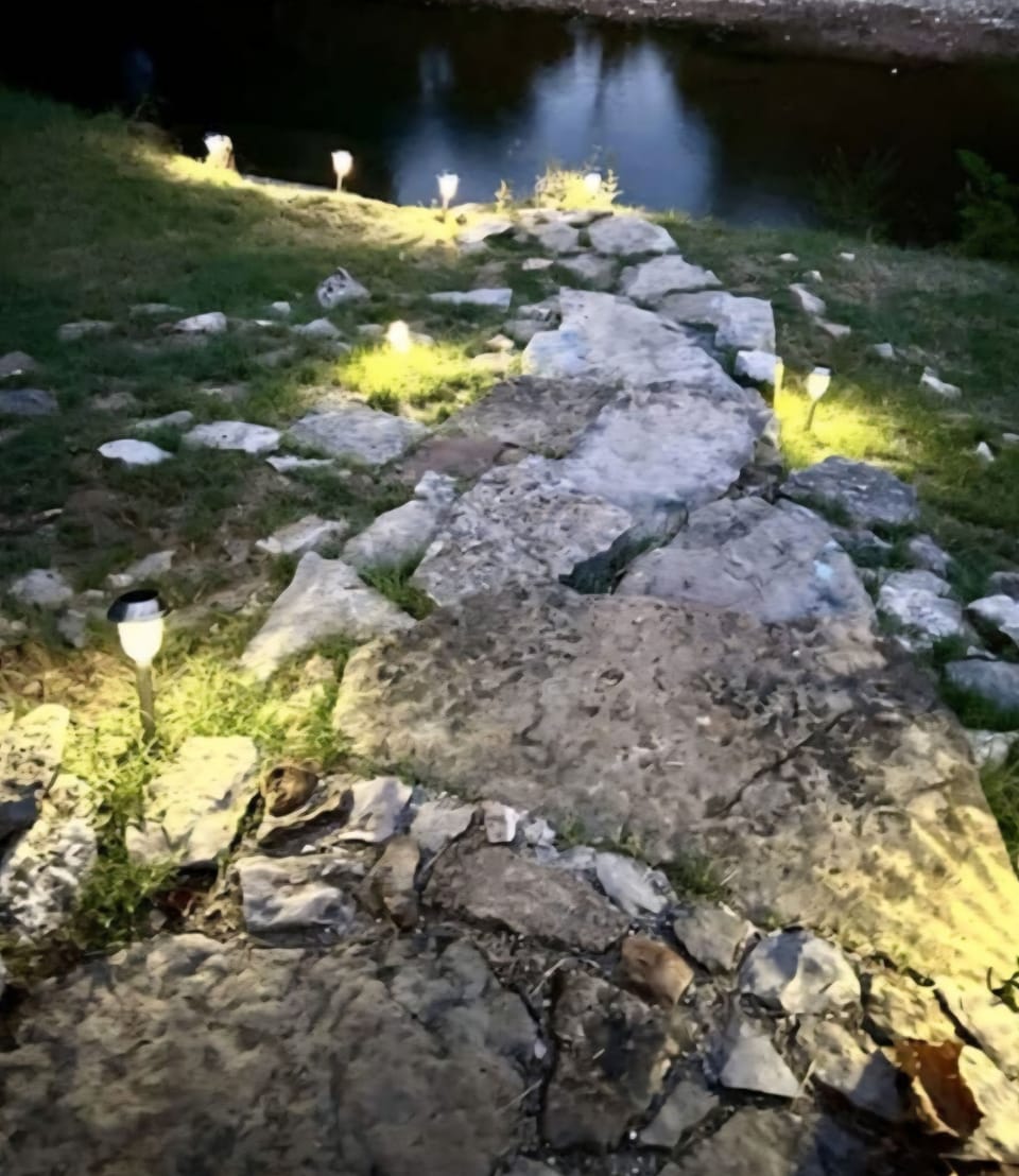 Rock stairway to the water which is the only safe route. Navigate only if agile!