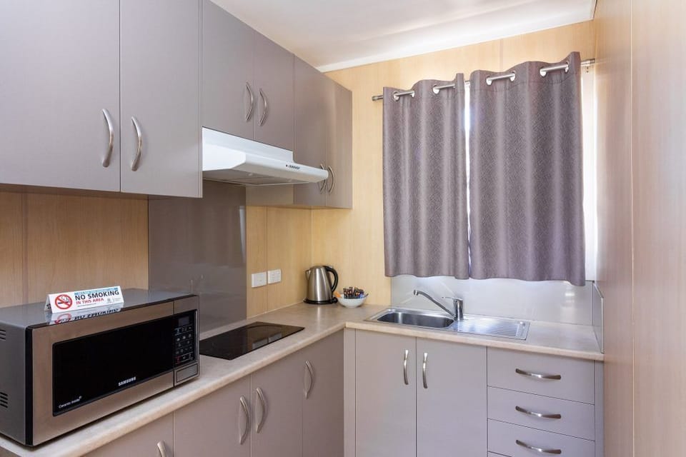 Standard 2 Bedroom Family Cabin 6,7,8 | Private kitchen | Full-size fridge, microwave, electric kettle, cleaning supplies