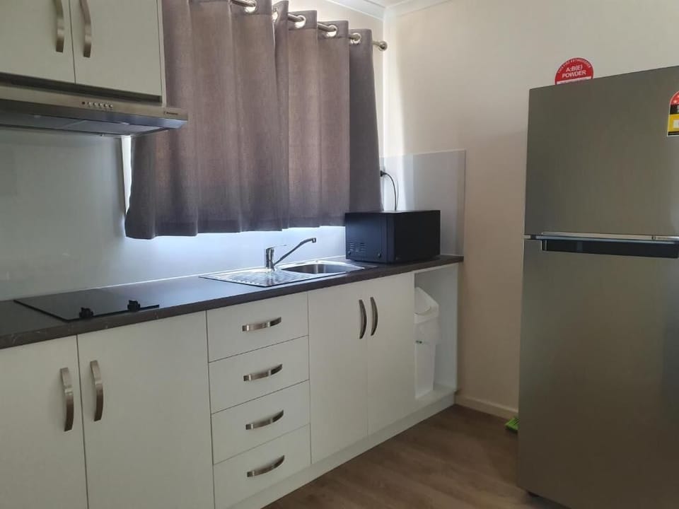 Deluxe 2 Bedroom Cabin 20,21,22 | Private kitchen | Full-size fridge, microwave, electric kettle, cleaning supplies