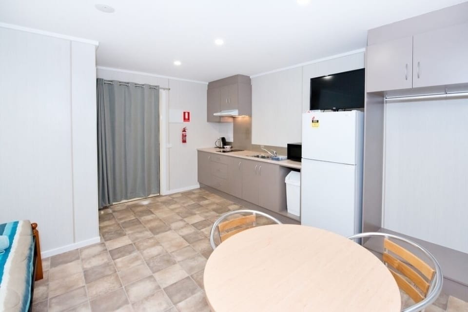 Standard Family Cabin 5, Queen bed with 1 Bunk Bed | Private kitchen | Full-size fridge, microwave, electric kettle, cleaning supplies