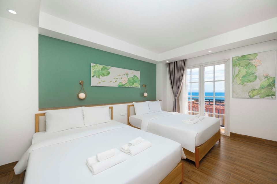 Family Room, Ocean View | Minibar, in-room safe, desk, laptop workspace