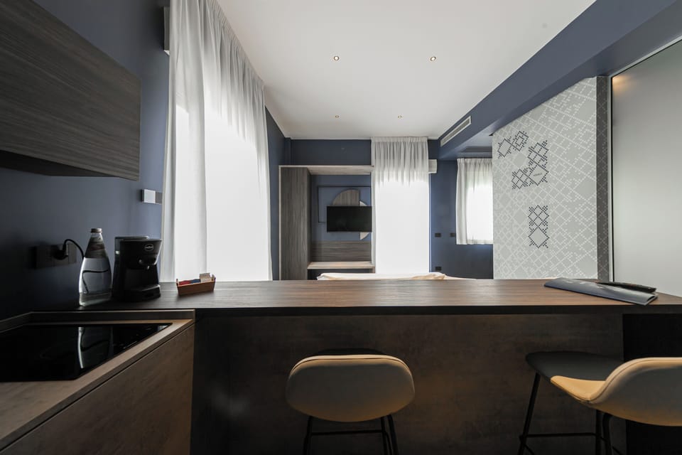 Deluxe Room | Private kitchen | Fridge, espresso maker, coffee/tea maker, cleaning supplies