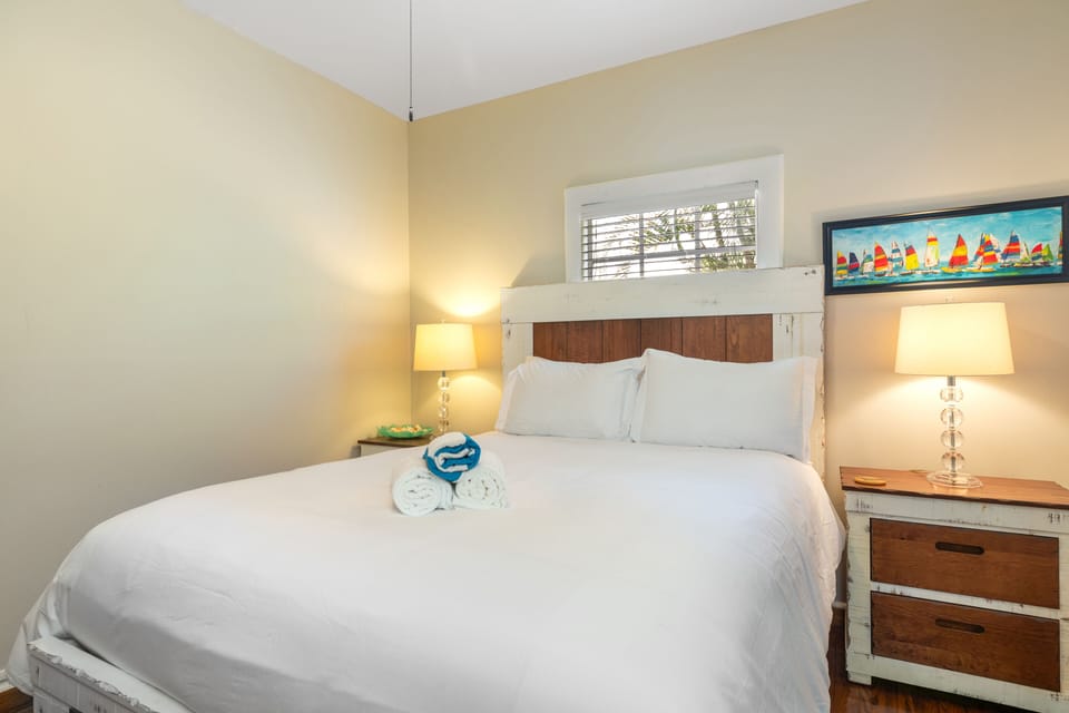 Bedroom 2 features a queen bed.