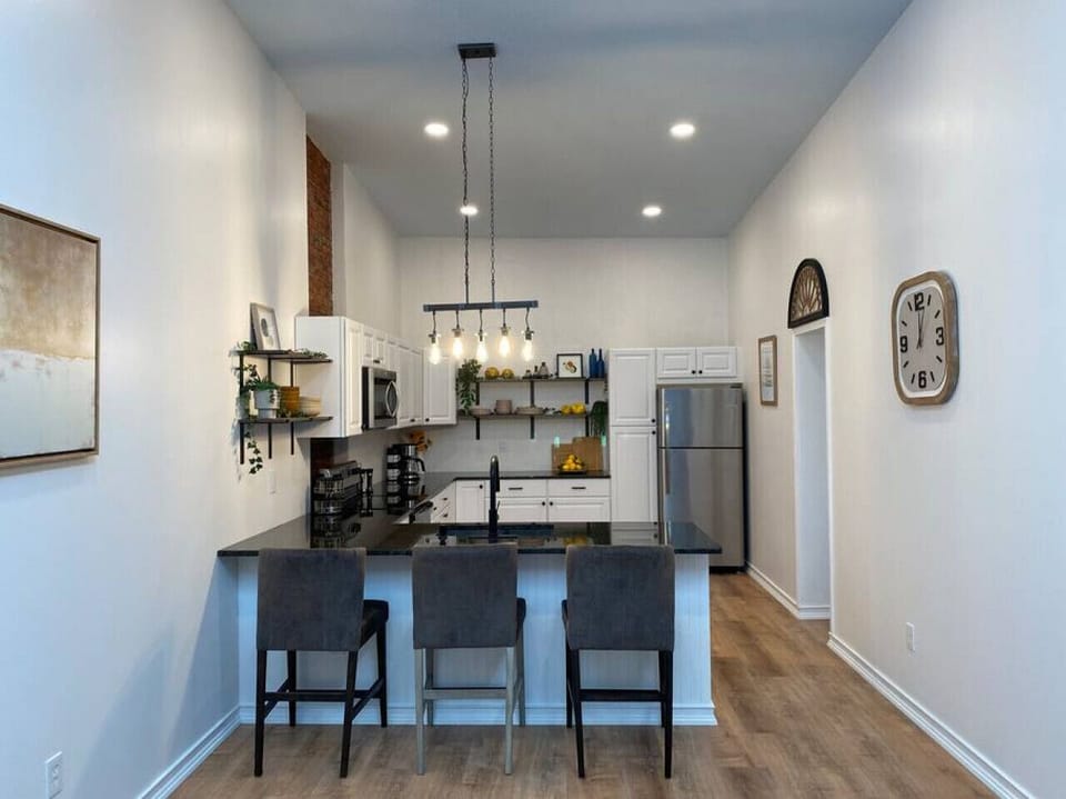 Open Concept full kitchen with granite counters and stainless steel  appliances.