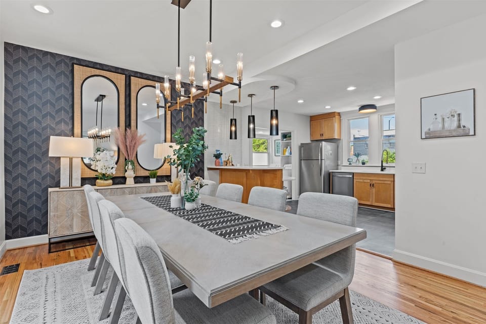 Stylish dining space with seating for the whole group—perfect for shared meals, game nights, or cocktails before heading out for a night in Martini Corner.