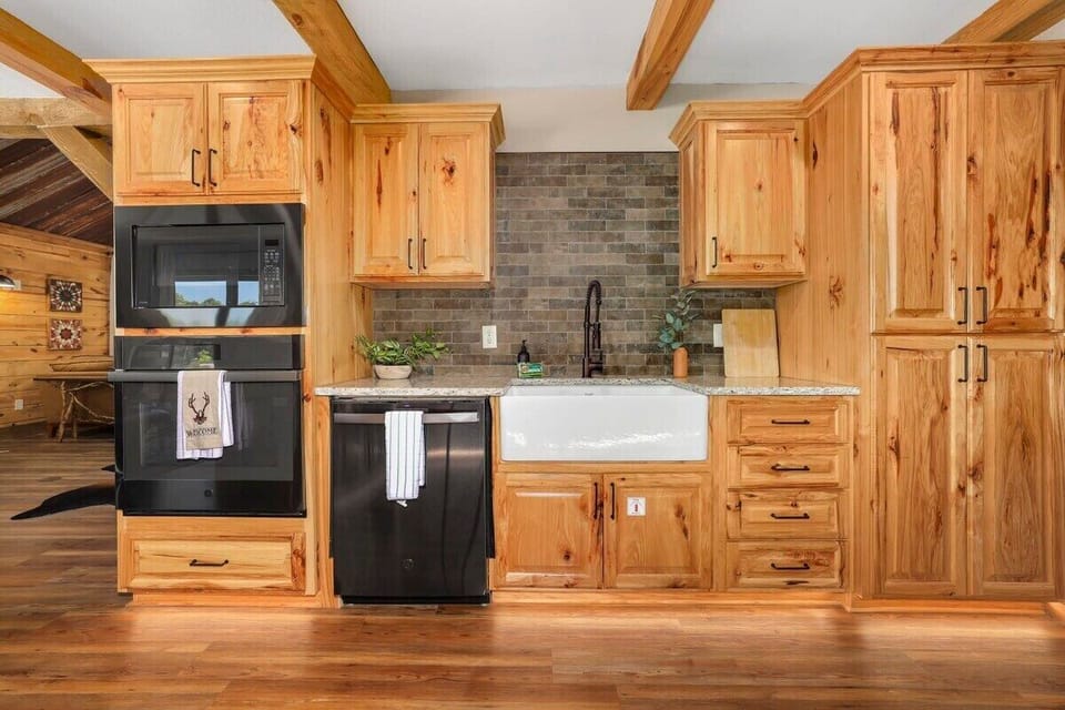You'll immediately notice our gorgeous natural wood cabinets and porcelain farmhouse sink.