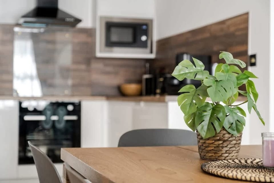 Full Kitchen | Savor the luxury of a fully-equipped kitchen, designed for any duration of stay. Revel in modern conveniences such as a washer, dryer, dishwasher, nespresso machine, and a fresh water dispenser, ensuring your comfort.
