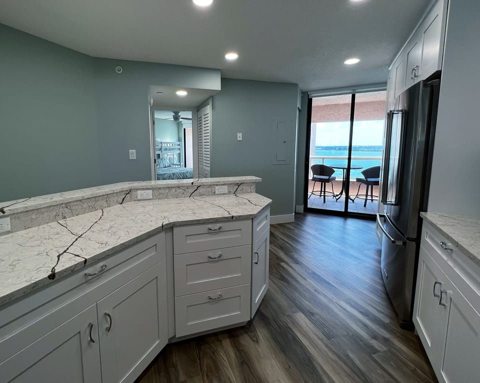 Coffee on the kitchen balcony, anyone? Enjoy a view of the inter - Coffee on the kitchen balcony, anyone? Enjoy a view of the intercoastal water of Clearwater from the kitchen, guest bedroom, guest bathroom, and balcony off the kitchen.