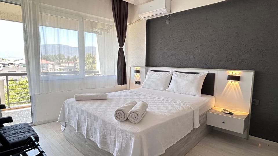 Standard Double Room, Balcony, City View | In-room safe, individually decorated, individually furnished, desk