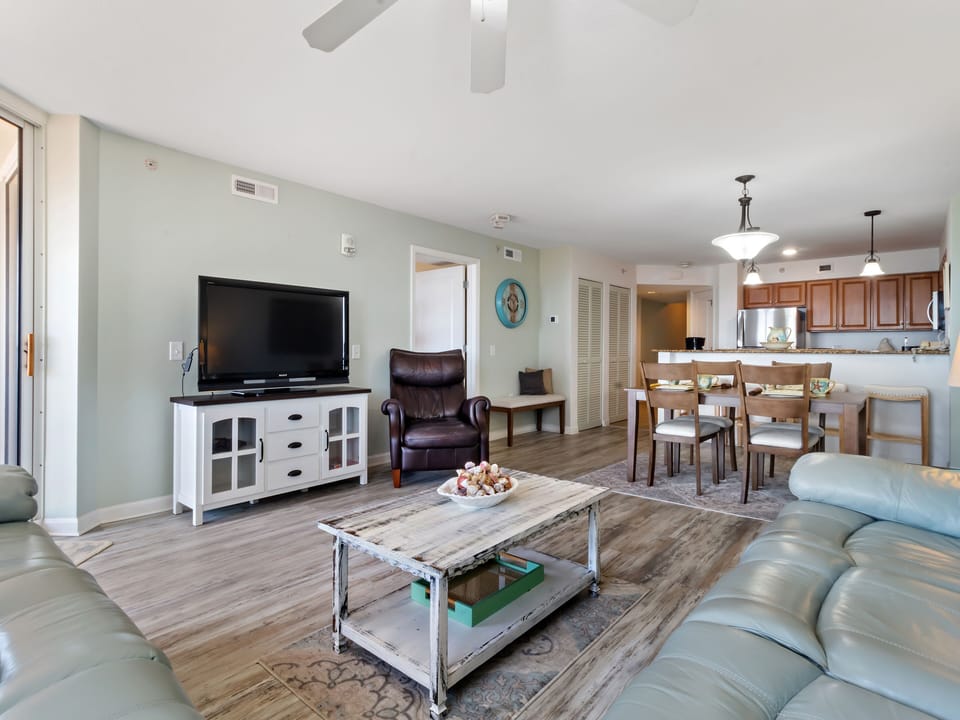 Relax in your open-concept living space with coastal hues and modern comfort throughout your home away from home.