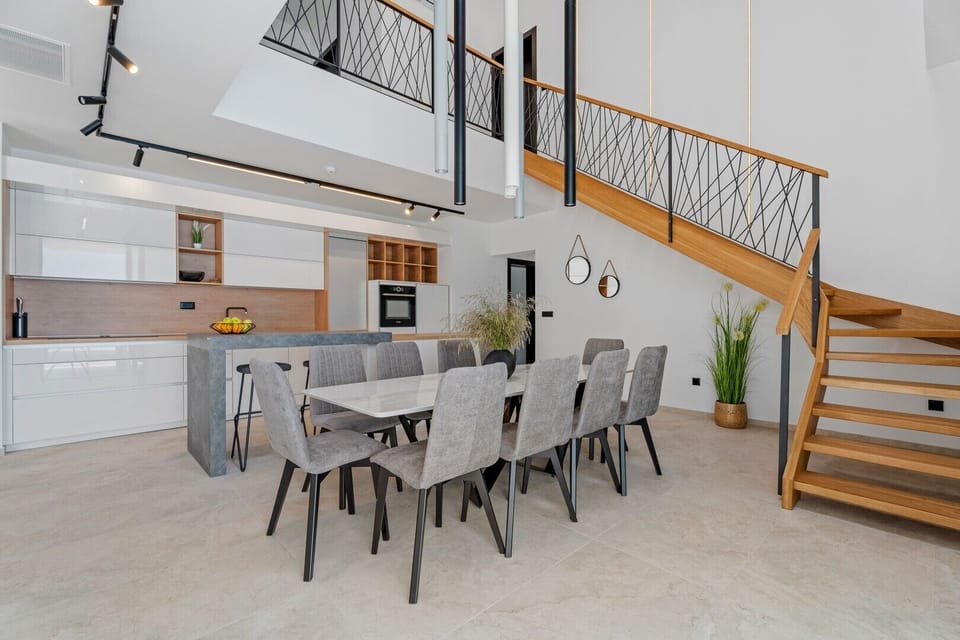 The GROUND floor has an open-plan living area that includes: a fully equipped kitchen (38sqm) with all the amenities a modern guest needs
