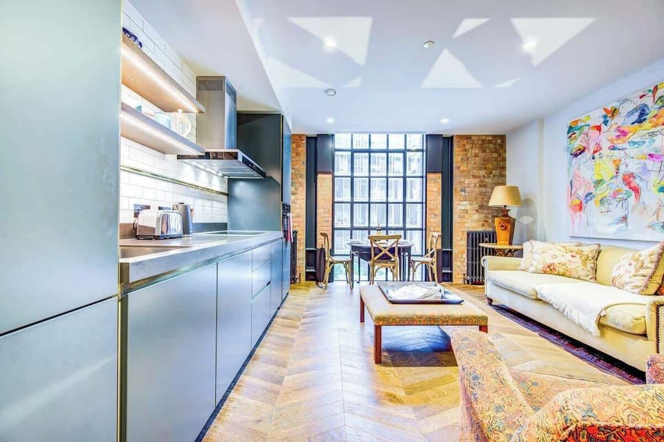 Open plan living/kitchen and dining area with plenty of space to sit down and relax after a hard day at work or exploring the city of London.