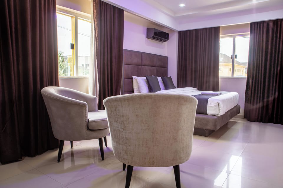 Deluxe Room, Refrigerator | Living area | Flat-screen TV