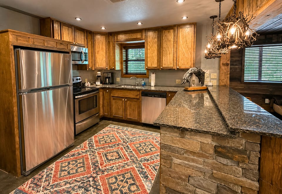 Downstairs, an additional kitchen gives the group even more flexibility for preparing snacks, drinks, or meals without having to head back upstairs.