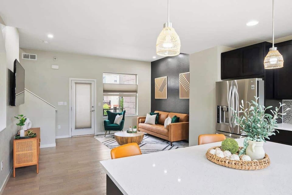 "Experience cozy luxury in this spacious sunlit living room! Perfect for unwinding after a day exploring the city. This Airbnb rental offers all the amenities you need to make your stay comfortable and enjoyable!"