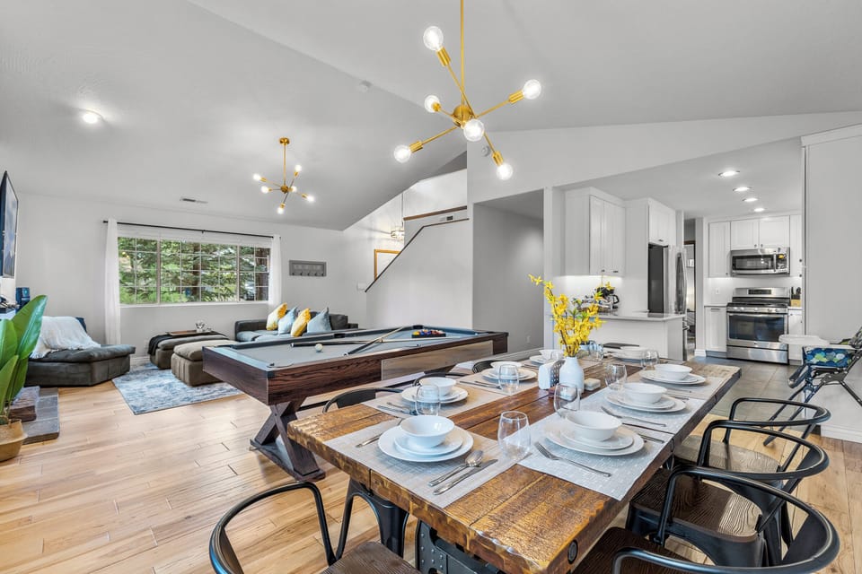 Entertainment Haven: Indoor Living Room with Pool Table and Elegant Dining Table
