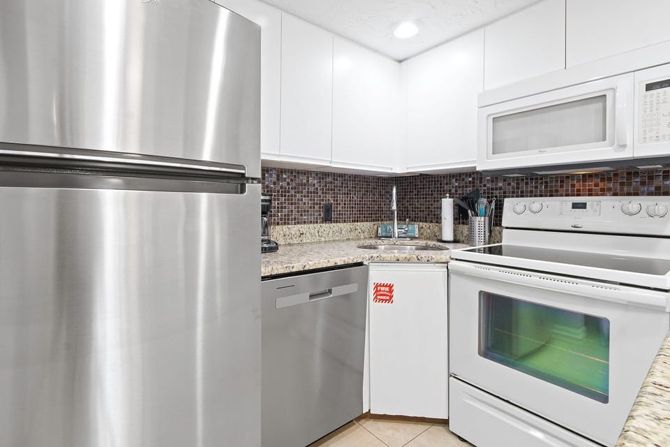 Modern, fully equipped kitchen for basic cooking.