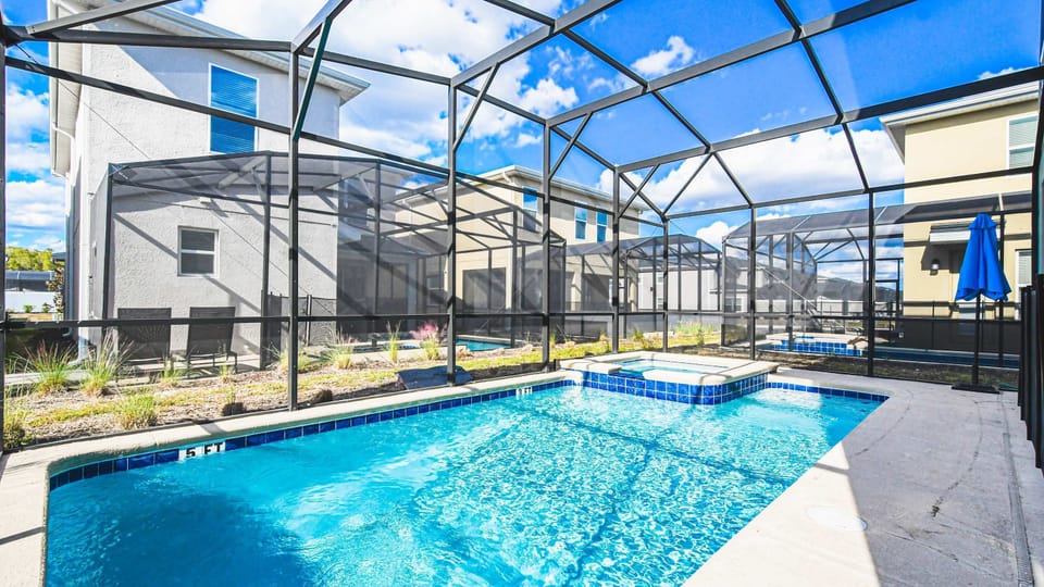 Private screened pool and spa with sunny patio—perfect for relaxing or playtime