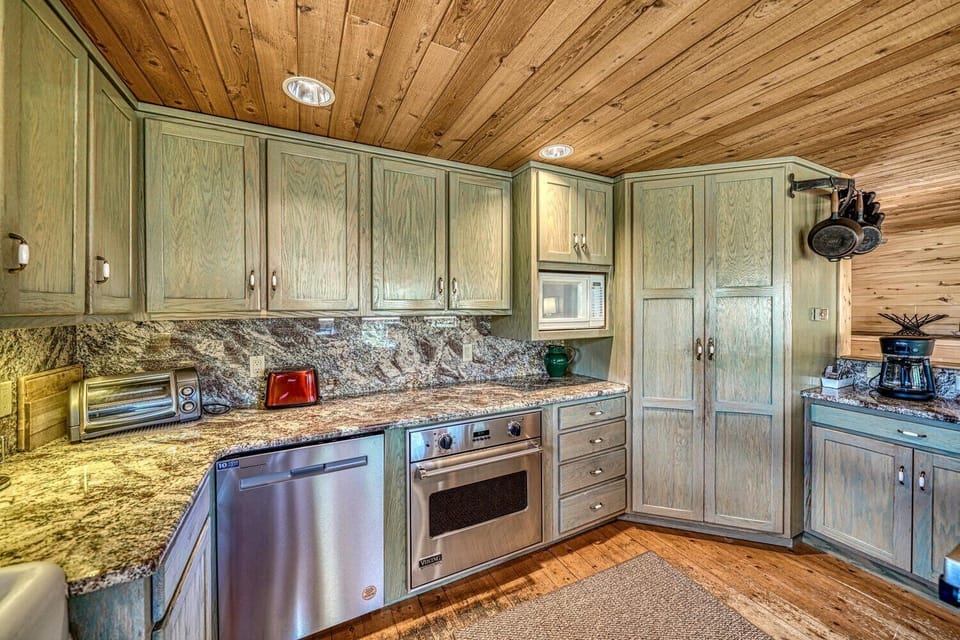 Fully-appointed kitchen with bar seating, dishwasher, pantry, and coffee maker.