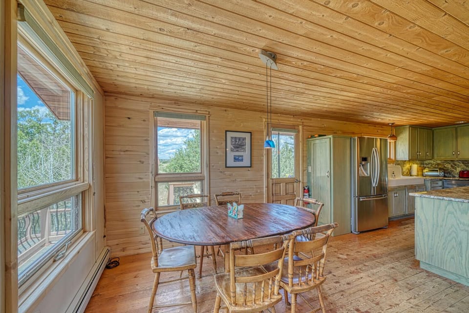 Dining room with mountain views and seating up to 6.