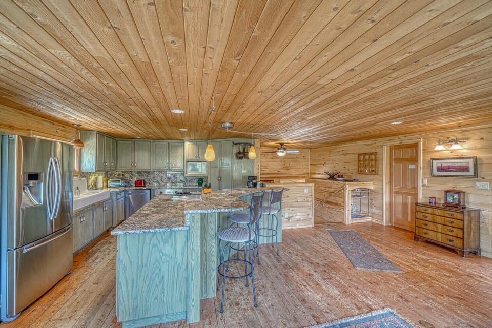 Fully-appointed kitchen with bar seating, dishwasher, pantry, and coffee maker.