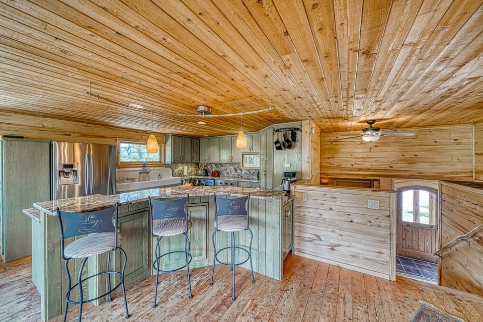 Fully-appointed kitchen with bar seating.