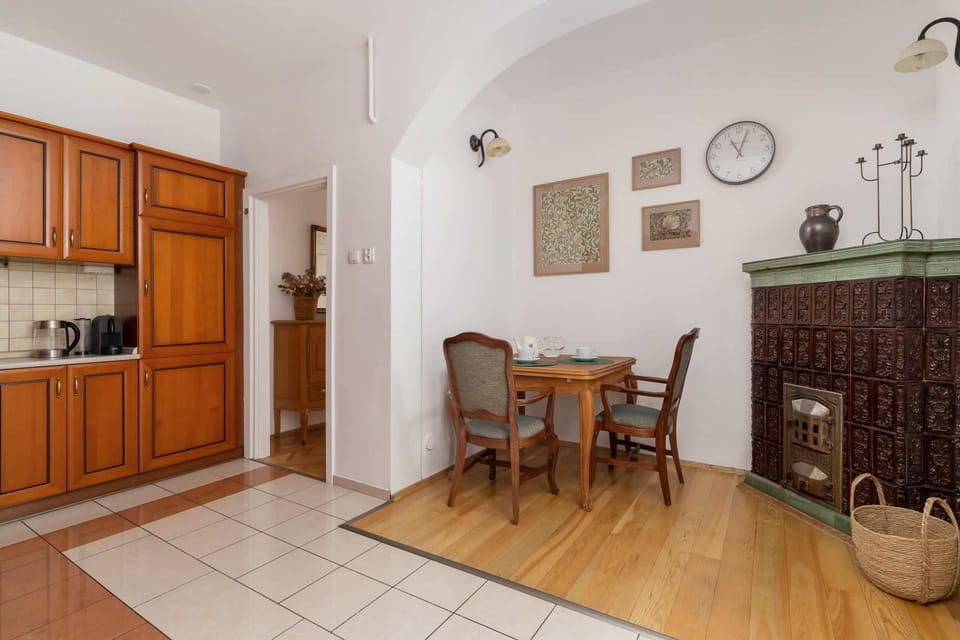 A view of the kitchen blending into the dining space, featuring vintage decor and practical layout.

