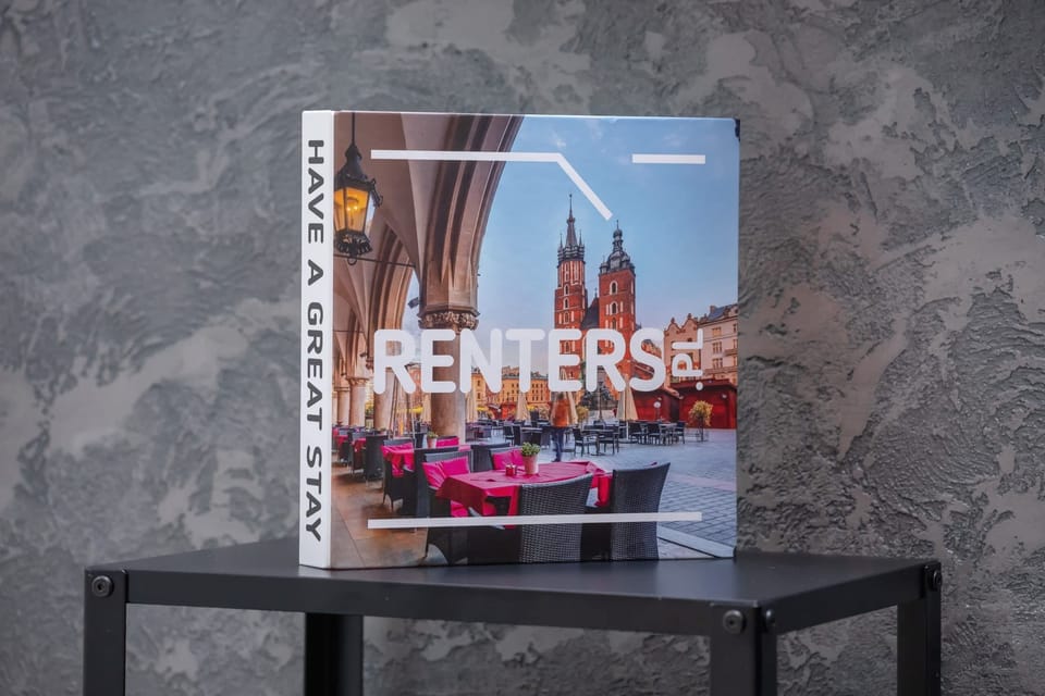 A magazine display featuring local information, placed on a contemporary black stand.

