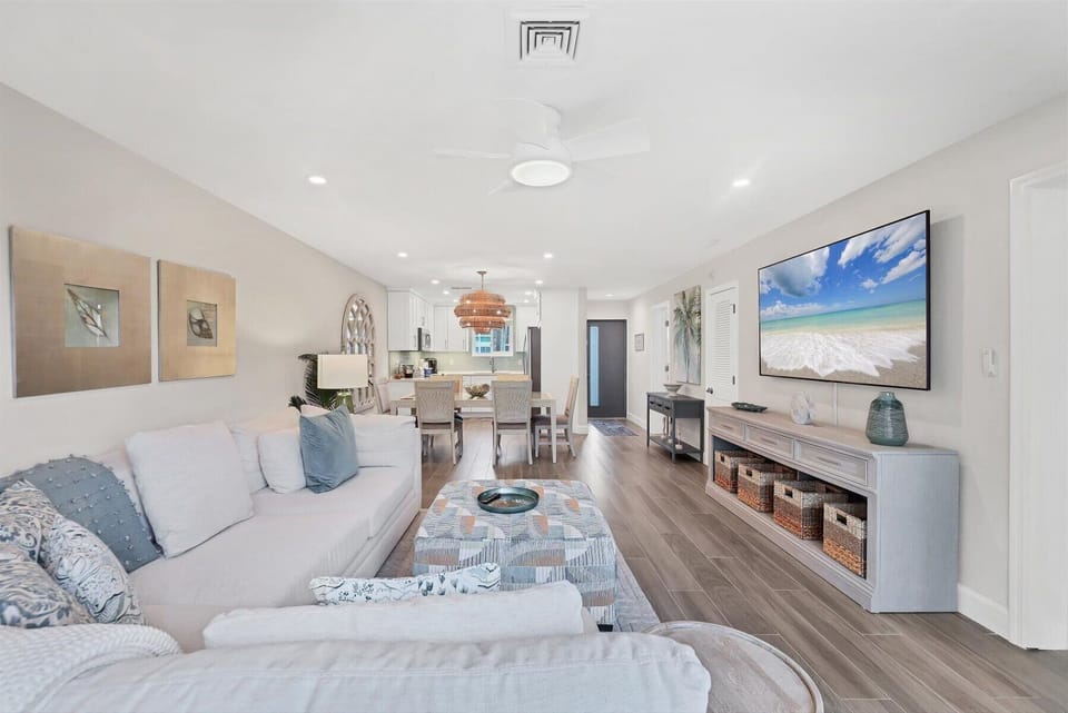 Settle into your bright, open-concept space where coastal charm meets modern comfort—perfect for unwinding after beach adventures.