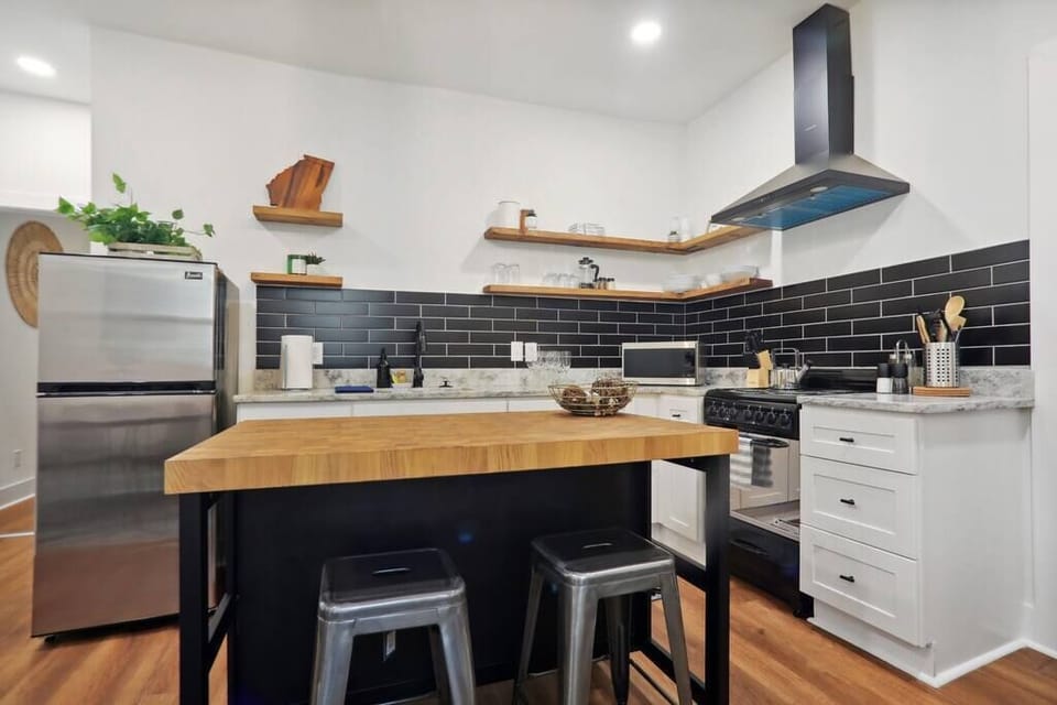 The kitchen has a butcher block 