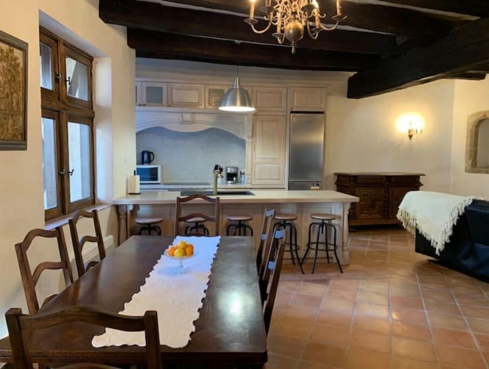 Kitchen with all modern appliances and dining table for 8-9 guests. 