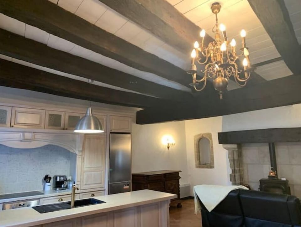 Kitchen with all modern appliances and dining table for 8-9 guests. 