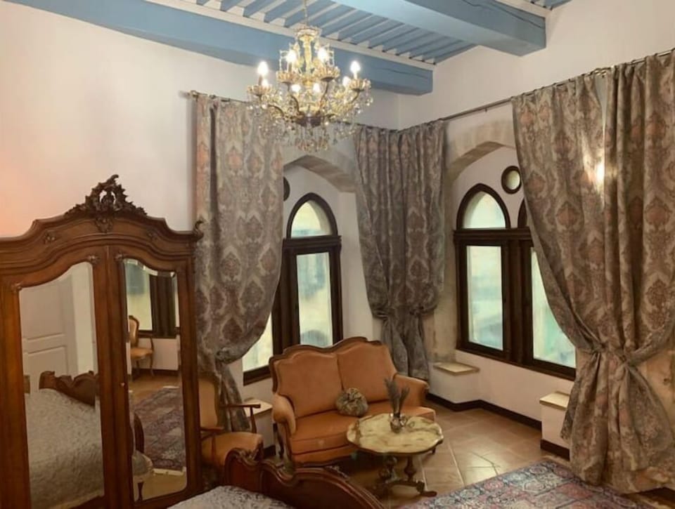 Royal Chamber with king size bed , seating aria and gothic style windows!