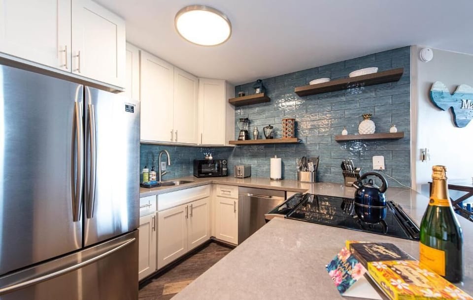 Luxury Condo | Private kitchen | Full-size fridge, microwave, oven, stovetop