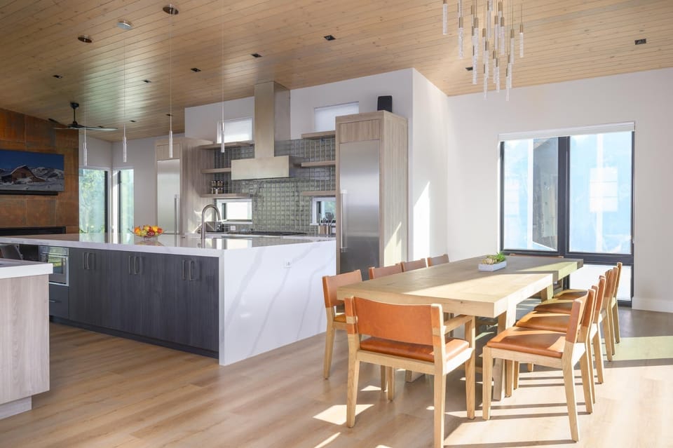 The gourmet kitchen and dining area flow together seamlessly