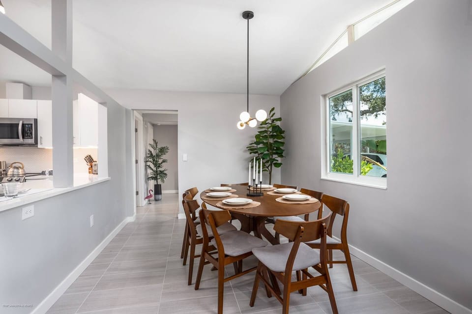 Off the kitchen is dining for 6-8 people on a beautiful solid wood table!
